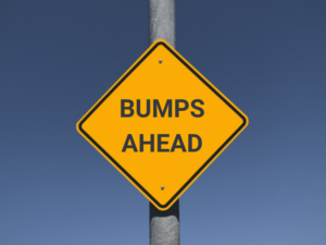 Traffic sign stating "bumps ahead"